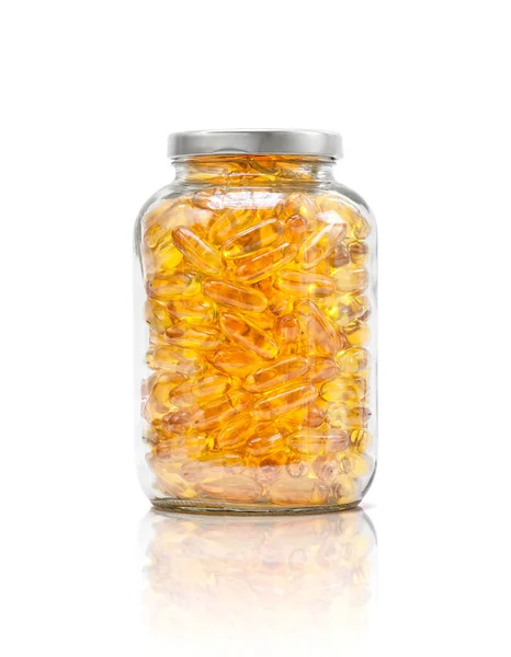 Fish oil supplement capsule in clear glass bottle — Stock Photo, Image