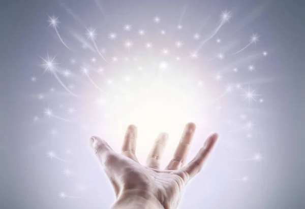 Hand with magical glowing light — Stock Photo, Image