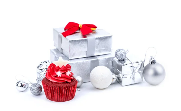 Merry Christmas and Happy New Year with red cupcake and silver gift boxes
