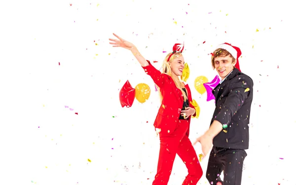 Young couple enjoy with colorful confetti in new year celebration hangout party — Stock Photo, Image