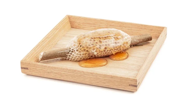 Honeycomb on wooden plate for food ingredients isolated on white background — Stock Photo, Image