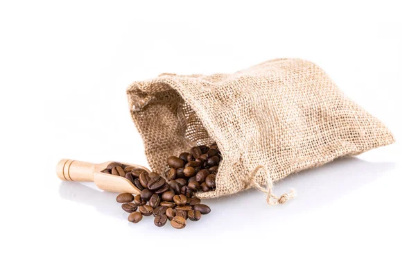 Coffee beans in burlap bag with wooden scoop — Stock Photo, Image