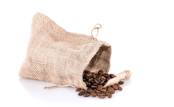 Coffee beans in burlap bag with wooden scoop — Stock Photo, Image