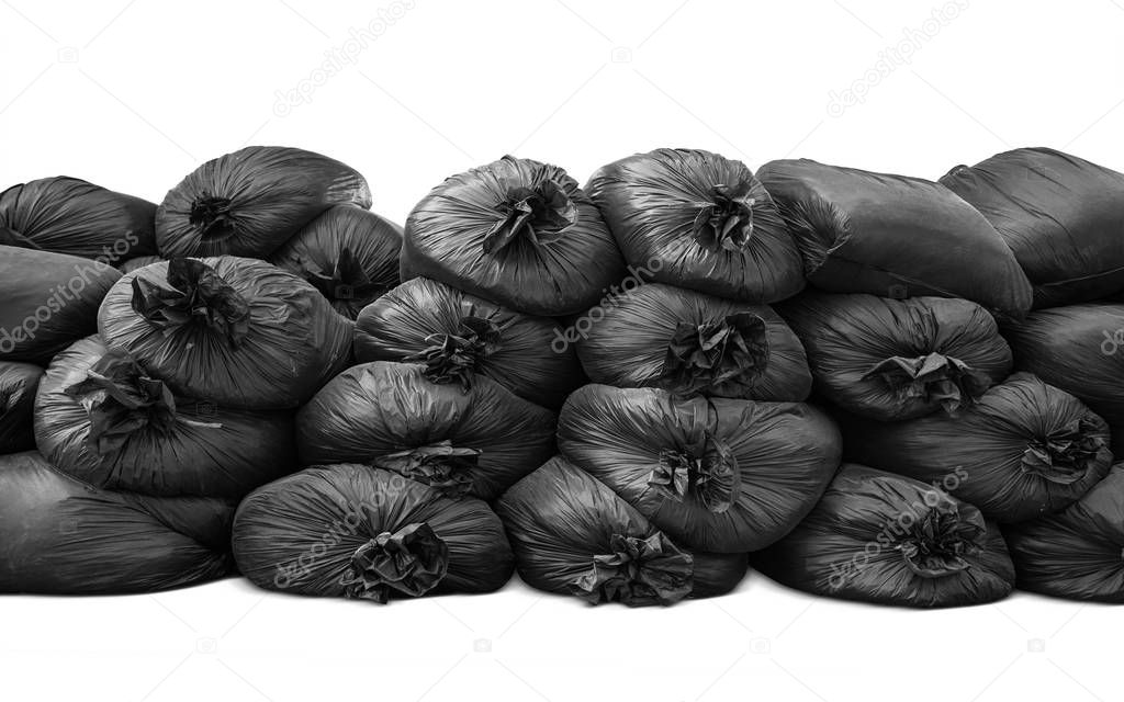 black trash bag pile up and isolated on white background