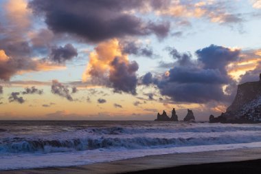 Iceland winter, trolls fingers rock, Vik village, sunset in Iceland