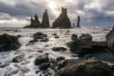 Iceland winter, trolls fingers rock, Vik village, sunset in Iceland