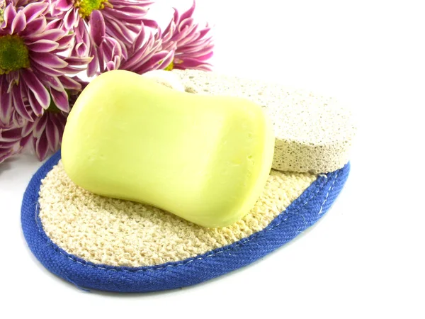 Soap bar on white bath towel and scrub — Stock Photo, Image