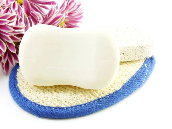 Soap bar on white bath towel and scrub — Stock Photo, Image