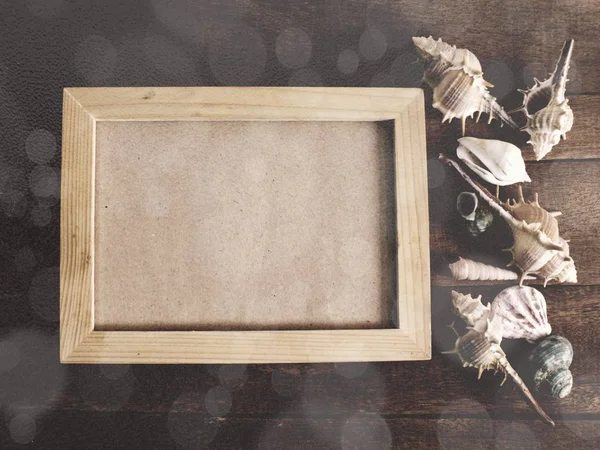 Frame for a photo in a marine style on wooden background summer concept — Stock Photo, Image