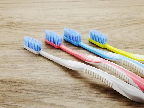 Top view toothbrushes on wooden background with space copy — Stock Photo, Image