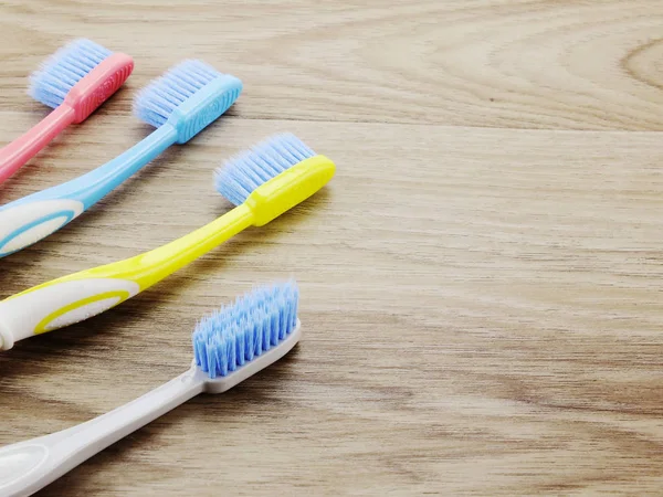 Top view toothbrushes on wooden background with space copy — Stock Photo, Image