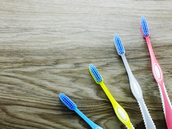 Top view toothbrushes on wooden background with space copy — Stock Photo, Image