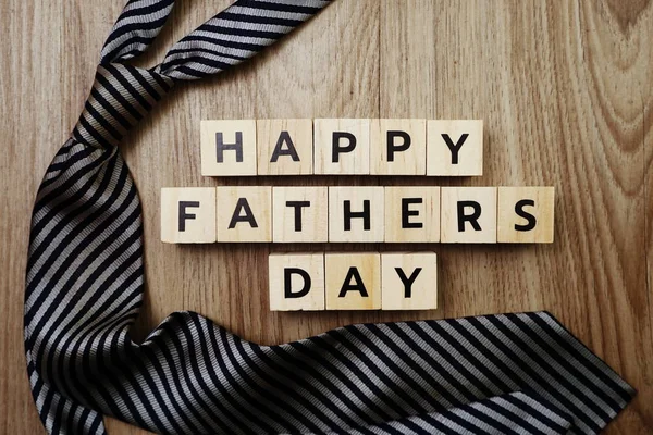 Happy Father\'s Day concept with DAD alphabet letter with space copy on wooden background