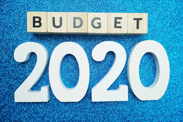 Budget 2020 word alphabet letters on blue glitter background