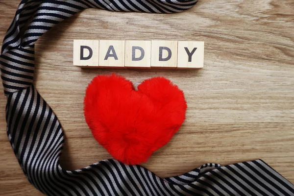 Happy Father\'s Day concept with DADDY alphabet letter with space copy on wooden background