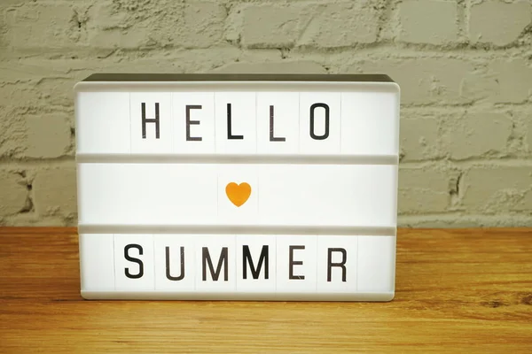 Hello Summer Word Light Box White Brick Wall Wood Background — стоковое фото