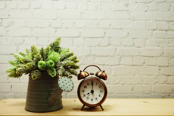 Alarm Clock Artificial Plant Decorative White Brick Wall Background — Stock Photo, Image