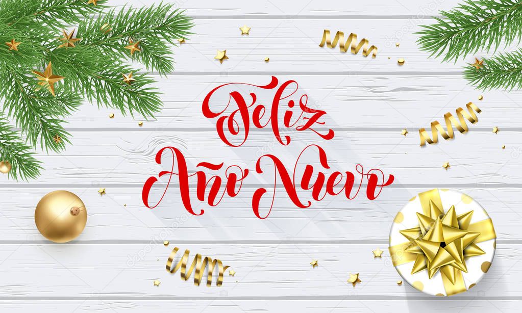 Feliz Ano Nuevo Spanish Happy New Year golden decoration and calligraphy font on white wooden background for greeting card. Vector Christmas gold shiny star on Xmas tree for winter holiday