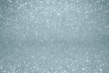 Gümüş Sim doku arka plan ile bulanıklık ışığı efekti ve parlak ışıltılı parçacıklar. Gümüş veya parlayan kar modern trendy şenlikli Noel arka plan tasarım şablonu için hafif pırıltılı