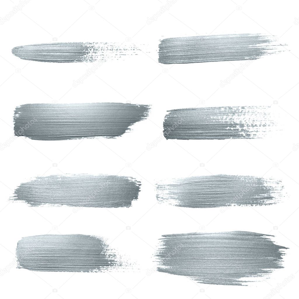 Silver glitter paint brush strokes set or abstract dab smear with smudge texture on white background. Isolated glittering silver paint ink paintbrush splash stain for luxury cosmetic design