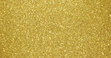 Altın parıltılı arka plan, ışıldayan parçacık dokusu. Altın ışık ve pırıl pırıl folyo pullar. Parlak kıvılcımlar saçan arka plan.