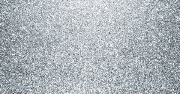 Silber glitzernder Hintergrund mit funkelnder Textur. Silber schimmerndes Licht, Sterne Pailletten Funken und glitzernde Glühfolie Hintergrund — Stockfoto