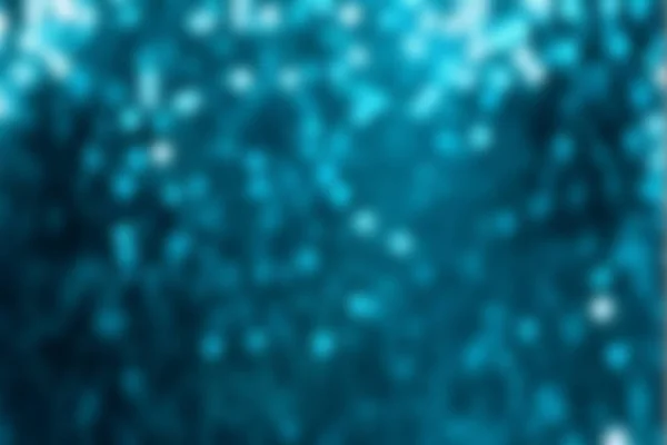 Glitter sparkling abstract blue bokeh defocused background. The white snow against the blue sky — Stock Photo, Image