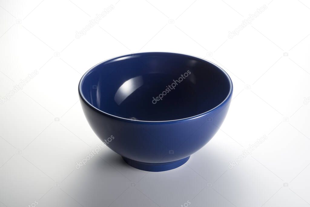 Empty blue bowl isolated on white background with clipping path