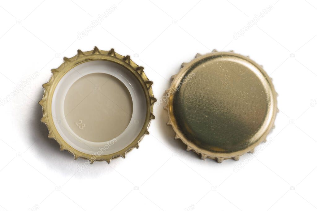Top view of Golden crown caps without logos isolated on white background
