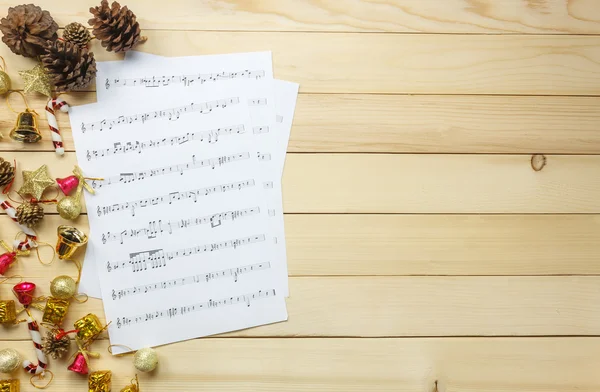 music sheet note paper and christmas decoration