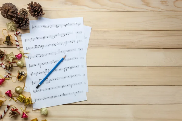 music sheet note paper and christmas decoration
