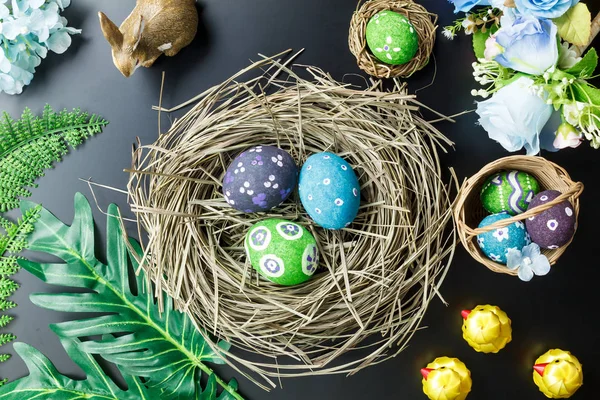 Top view Easter background.Happy easter eggs pained also rabbit