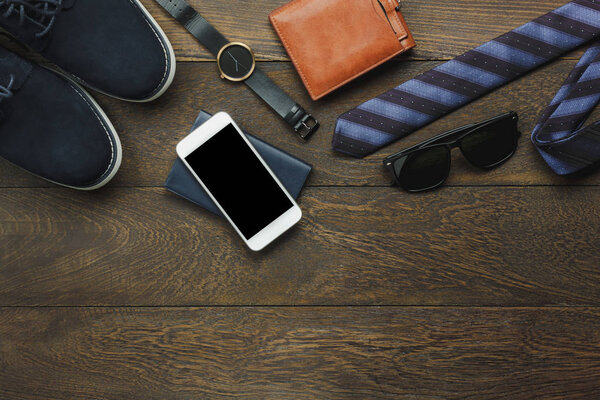 Above view of items to travel with technology background concept.