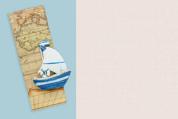 Table top view aerial accessory plan to travel in holiday background concept.Flat lay essential items boat with map on modern blue & white paper.Duo backdrop with pastel tone.space for creative design