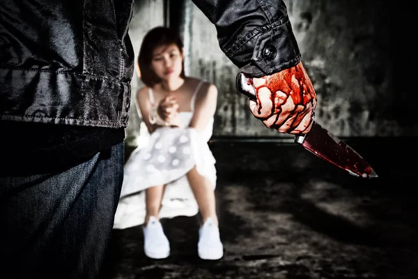 Murderer bloody hand holding knife smeared with blood ready to a — Stock Photo, Image