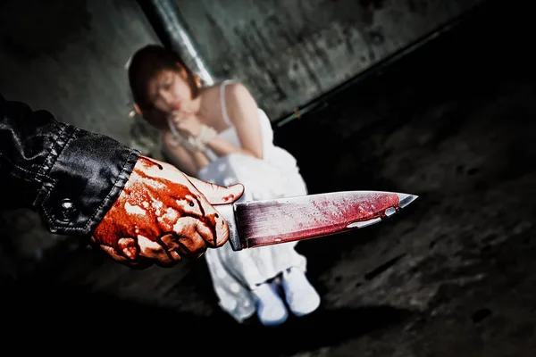 Murderer bloody hand holding knife smeared with blood ready to a — Stock Photo, Image