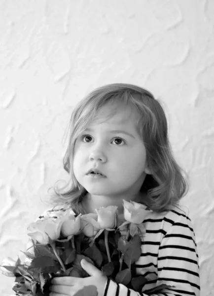 Little girl with flowers, black and white