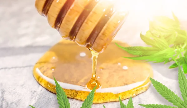 stock image CBD or THC Cannabis Honey on kitchen counter with Hemp leaves