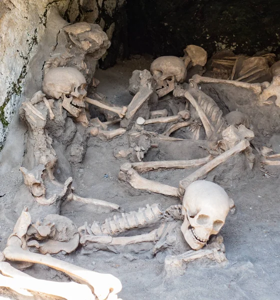 Skulls and bones found entombed in lava