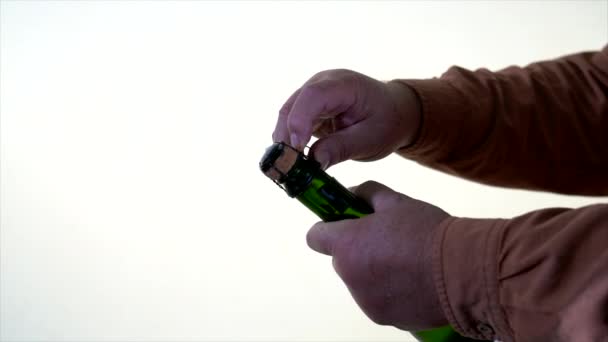 Champagne Bottle - wire cage being removed by man — Stock Video