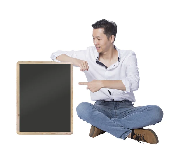 Homem mostrando um grande quadro negro — Fotografia de Stock