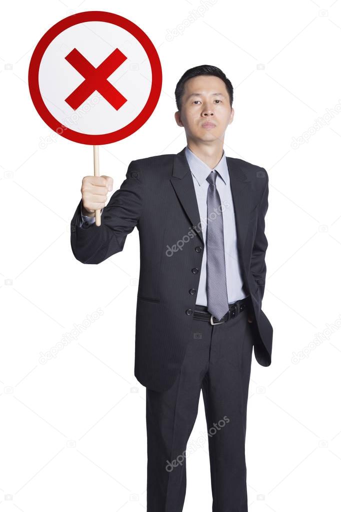 Businessman holding wrong sign