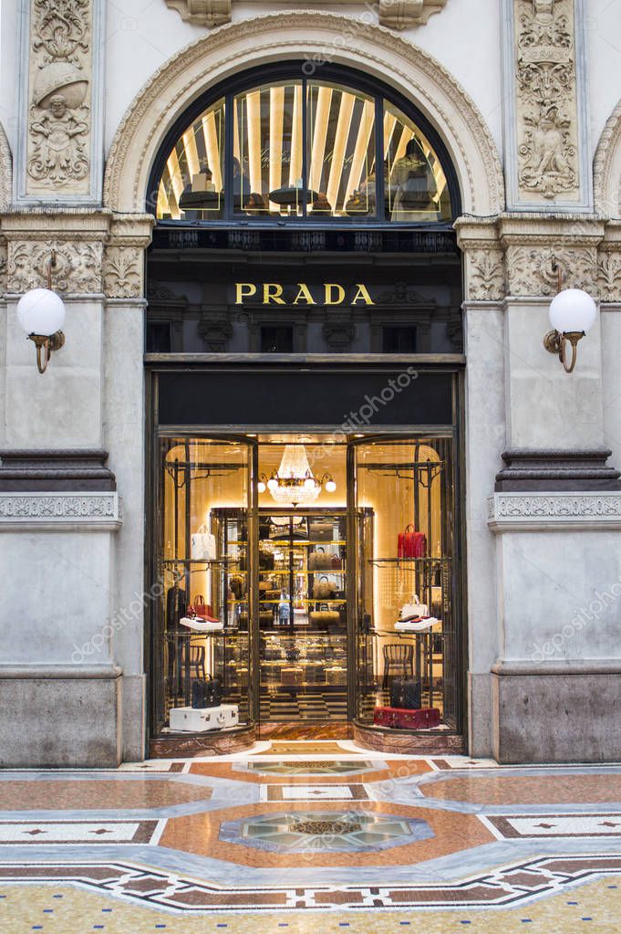 MILAN, ITALY - NOVEMBER 2016: PRADA boutique shop facade, retro and beautiful arch decorations, baroque architecture combined with fashion store