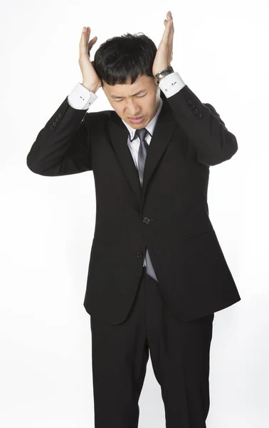 Empresario que sufre de dolor de cabeza — Foto de Stock