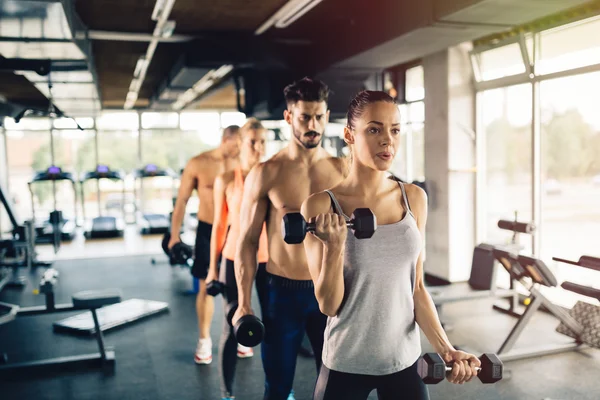 people training in gym together