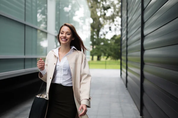 Beautiful businesswoman walking outside — Stock Photo, Image