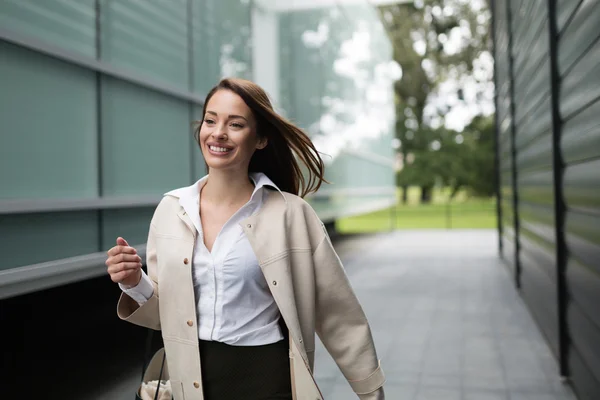 Beautiful businesswoman walking outside