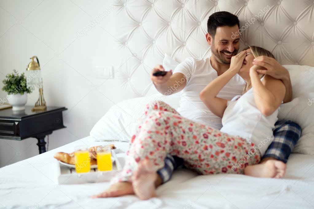 Couple relaxing in pajamas