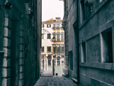 Narrow passage in Venice streets clipart