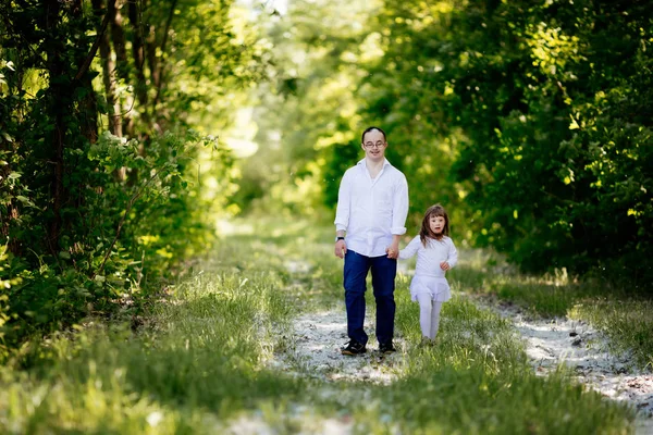 People with down sydrome walking in forest — Stock Photo, Image